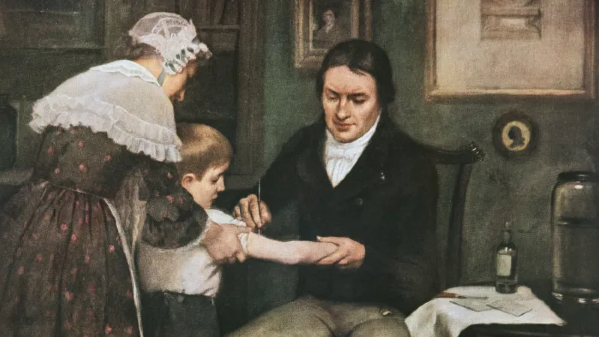 Bác sĩ Edward Jenner thực hiện lần đầu tiên tiêm phòng bệnh đậu mùa cho James Phipps, một cậu bé 8 tuổi vào ngày 14/5/1796. Ảnh: Getty Images
