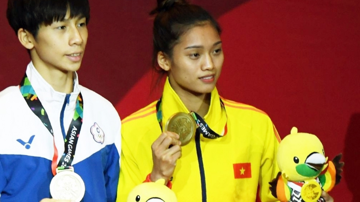 Nguyễn Thị Tâm (áo vàng) giành vé dự Olympic Tokyo 2020 (Ảnh: Getty).